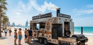 bbq food truck UAE parked at Dubai beachfront with smoker setup